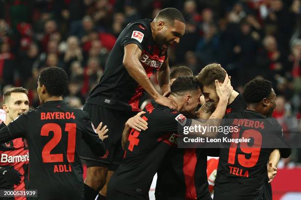Josip Stanisic of Bayer Leverkusen celebrates scoring his team's first goal with teammates during the Bundesliga match between Bayer 04 Leverkusen...