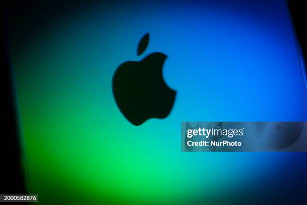 The Apple logo is seen on an iPhone in this illustration photo taken on 13 February, 2024 in Warsaw, Poland.