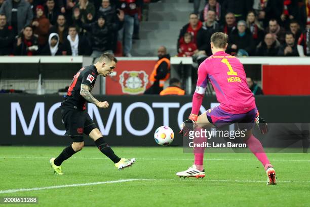 Alex Grimaldo of Bayer Leverkusen scores his team's second goal during the Bundesliga match between Bayer 04 Leverkusen and FC Bayern München at...