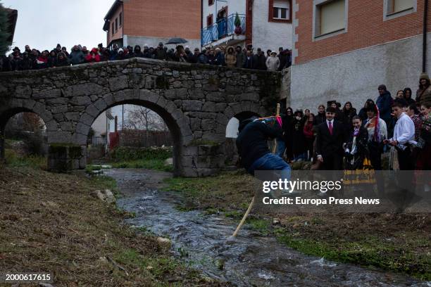 Young man jumps the river, as a symbol of the passage to maturity, during the Harramachos festival, on 10 February, 2024 in Navalacruz, Avila,...