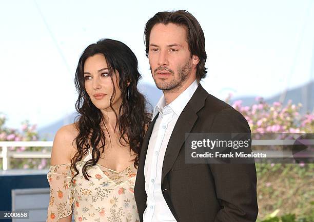 Actress Monica Bellucci and actor Keanu Reeves pose at a photocall for the film "The Matrix Reloaded" at the 56th International Cannes Film Festival...