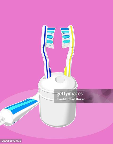 two toothbrushes and toothpaste - toothbrush holder stock illustrations