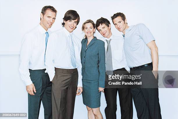 group of businessmen and businesswoman smiling, portrait - female with group of males stock pictures, royalty-free photos & images