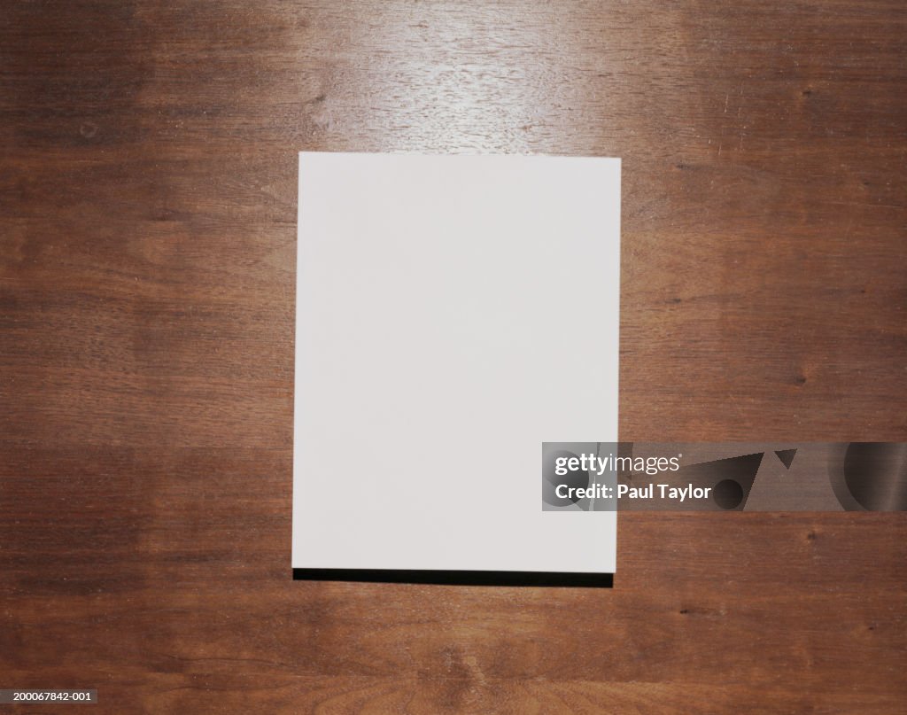 Blank paper on wood background