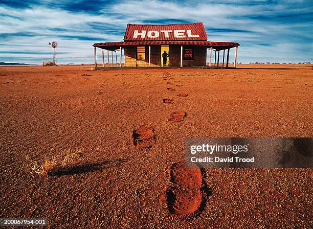 australia, new south wales, man standing in door way to hotel - outback stock pictures, royalty-free photos & images