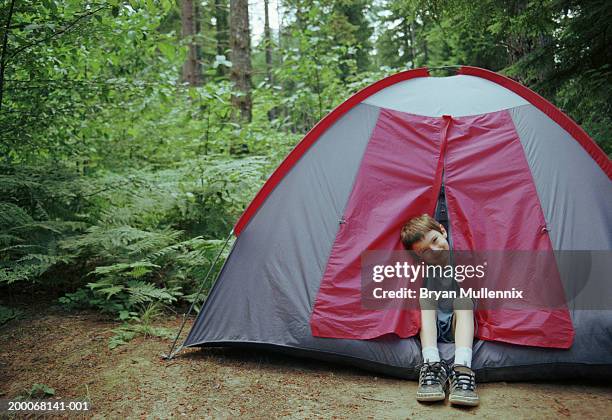 young boy (6-8) sitting in tent, portrait - open day 9 stock pictures, royalty-free photos & images