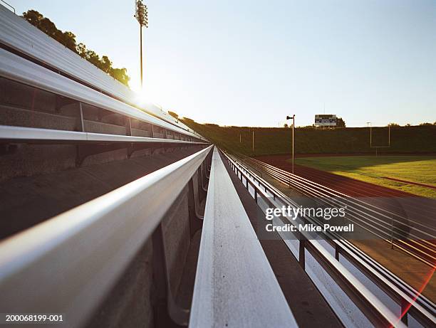 bleachers of track and field stadium - empty bleachers foto e immagini stock