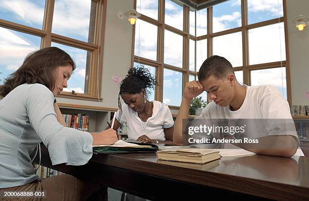 high school students working on homework in study hall, low angle view - table corner stock pictures, royalty-free photos & images