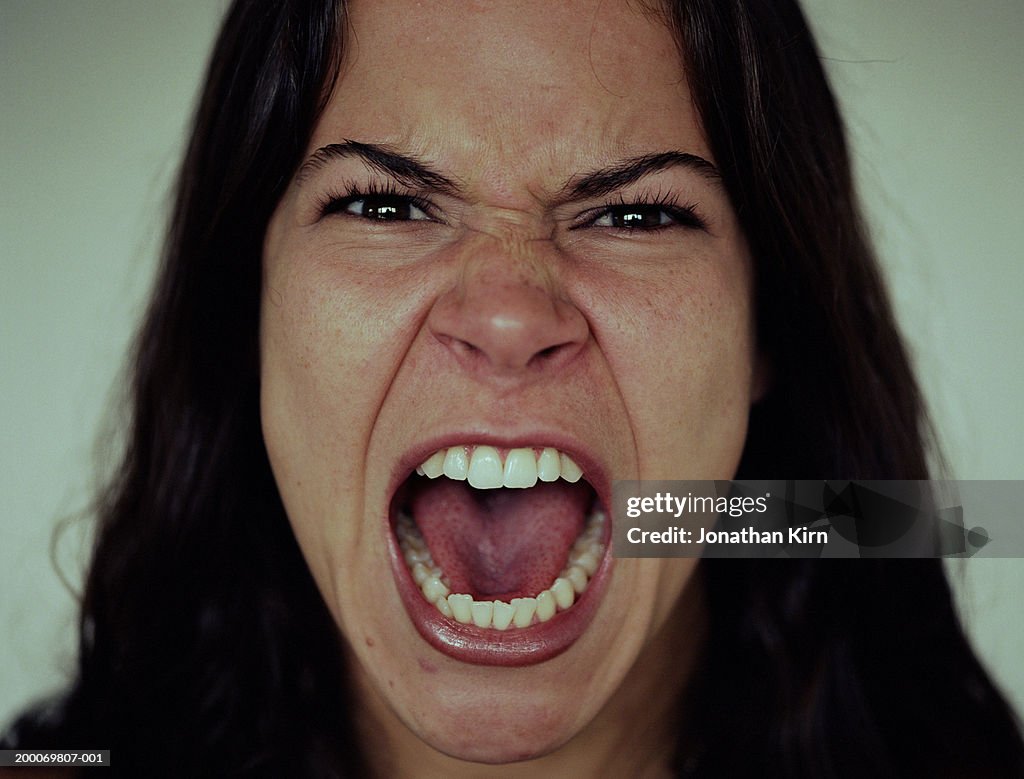 Young woman screaming, close-up