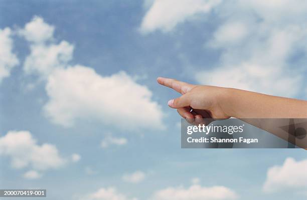 girl (8-10) pointing at clouds, close up - hand pointing stock pictures, royalty-free photos & images