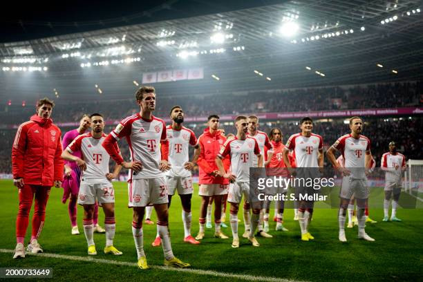 Thomas Mueller of Bayern Munich and teammates acknowledge the fans following the team's defeat during the Bundesliga match between Bayer 04...