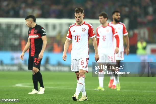 Odilon Kossounou of Bayer Leverkusen looks dejected following the team's defeat during the Bundesliga match between Bayer 04 Leverkusen and FC Bayern...
