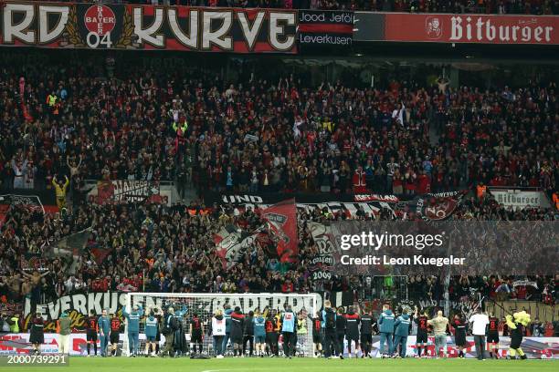 Players and fans of Bayer Leverkusen celebrate following the team's victory during the Bundesliga match between Bayer 04 Leverkusen and FC Bayern...