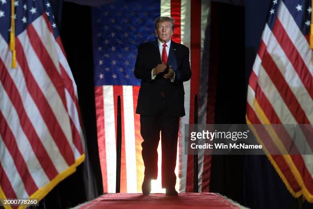 Republican presidential candidate and former President Donald Trump arrives on stage during a Get Out The Vote rally at Coastal Carolina University...