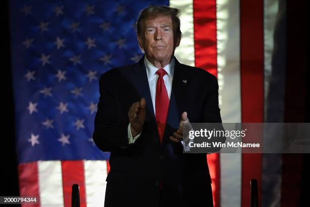 Republican presidential candidate and former President Donald Trump arrives on stage during a Get Out The Vote rally at Coastal Carolina University...