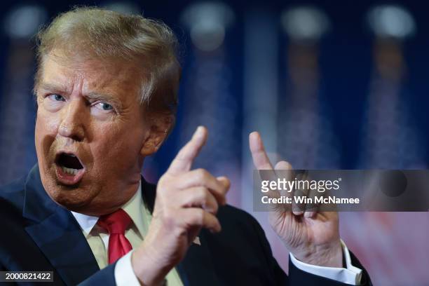 Republican presidential candidate and former President Donald Trump mocks U.S. President Joe Biden while speaking during a Get Out The Vote rally at...