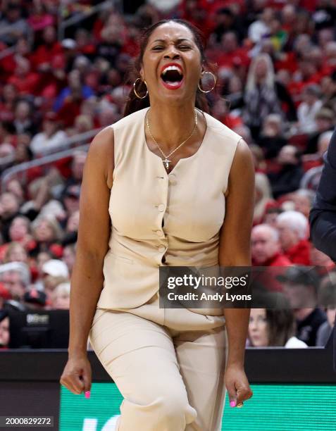 Niele Ivey the head coach of the Notre Dame Fighting Irish celebrates against the Louisville Cardinals during the second half at KFC YUM! Center on...