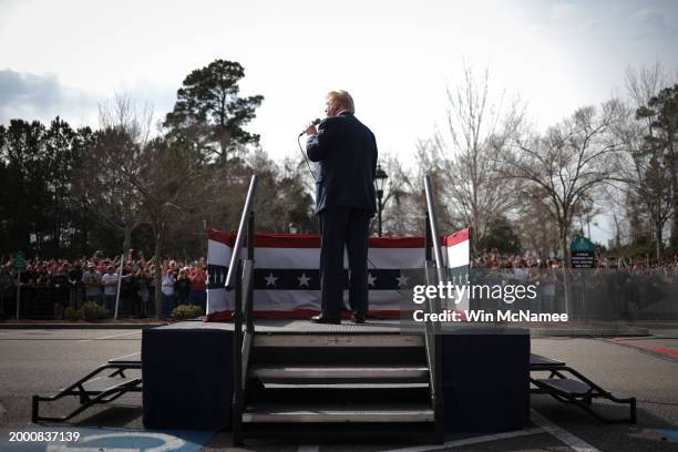 Republican presidential candidate and former President Donald Trump speaks to an overflow crowd during a Get Out The Vote rally at Coastal Carolina...