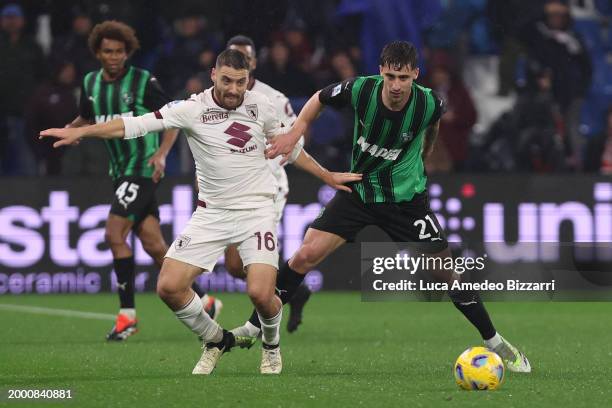 Nikola Vlašić of Torino FC competes for the ball with Mattia Viti of US Sassuolo during the Serie A TIM match between US Sassuolo and Torino FC -...
