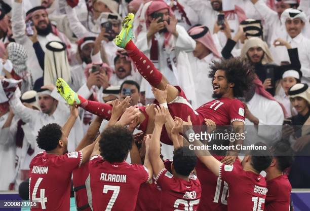 Akram Afif of Qatar celebrates with team mates following their sides victory in the AFC Asian Cup final match between Jordan and Qatar at Lusail...