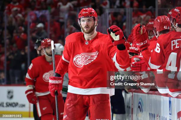 Michael Rasmussen of the Detroit Red Wings celebrates his third period goal with teammates while playing the Vancouver Canucks at Little Caesars...