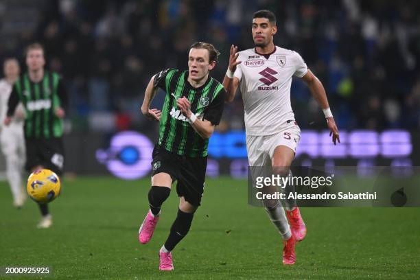 Marcus Pedersen of US Sassuolo competes for the ball with Adam Masina of Torino FC during the Serie A TIM match between US Sassuolo and Torino FC -...
