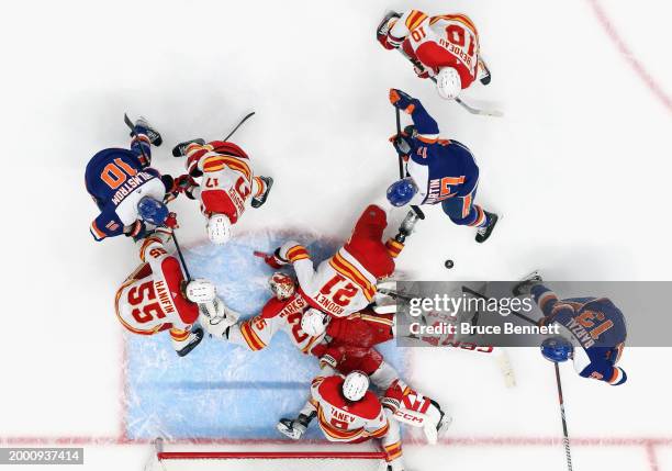 Jacob Markstrom and the Calgary Flames defend the net against the New York Islanders during the third period at UBS Arena on February 10, 2024 in...