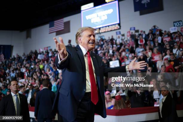 Republican presidential candidate and former President Donald Trump gestures to members of the audience as he leaves a Get Out The Vote rally at...