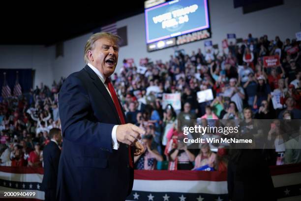 Republican presidential candidate and former President Donald Trump gestures to members of the audience as he leaves a Get Out The Vote rally at...