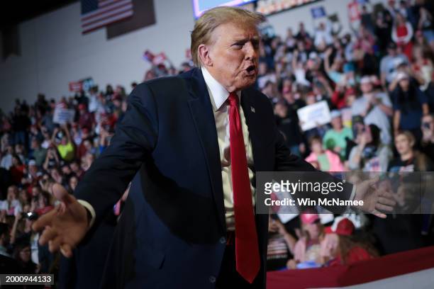 Republican presidential candidate and former President Donald Trump gestures to members of the audience as he leaves a Get Out The Vote rally at...