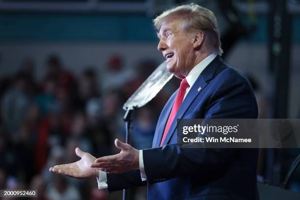 Republican presidential candidate and former President Donald Trump gestures to members of the audience as he leaves a Get Out The Vote rally at...