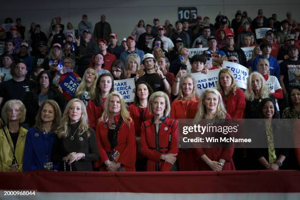 Supporters of Republican presidential candidate and former President Donald Trump listen while he speaks during a Get Out The Vote rally at Coastal...