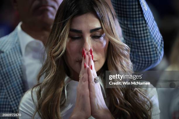 Trump supporter Siggy Flicker listens as Republican presidential candidate and former President Donald Trump speaks during a Get Out The Vote rally...