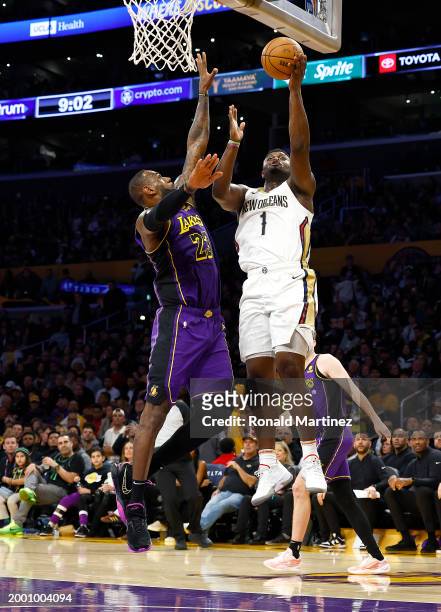 LeBron James of the Los Angeles Lakers and Zion Williamson of the New Orleans Pelicans in the second half at Crypto.com Arena on February 09, 2024 in...