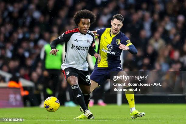 Willian of Fulham and Adam Smith ofb during the Premier League match between Fulham FC and AFC Bournemouth at Craven Cottage on February 10, 2024 in...