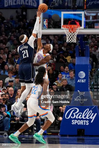 Daniel Gafford of the Dallas Mavericks makes a move to the basket over Shai Gilgeous-Alexander of the Oklahoma City Thunder during the second half at...