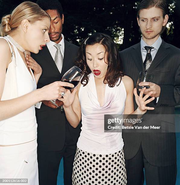 four people holding drinks, young woman with red wine spilt down top - spilling bildbanksfoton och bilder