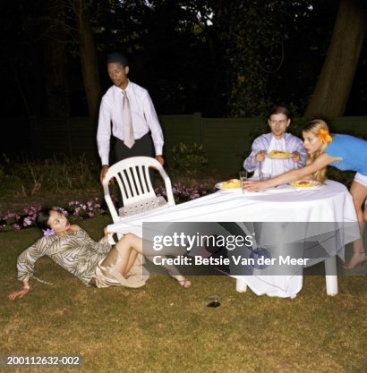 Fallen Over Table Four Friends Dining Outdoors Woman Falling Pulling Cloth From Table ...