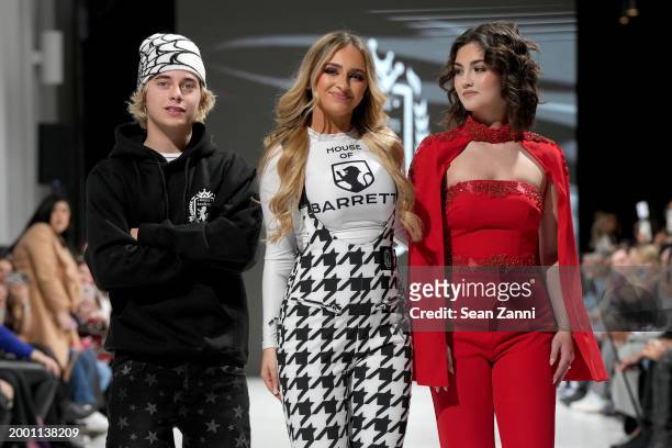 Designer Isabella Barrett greets the audience from the runway with Gavin Magnus and Sabrina Cardone during the House Of Barretti Billionaire Barbie...