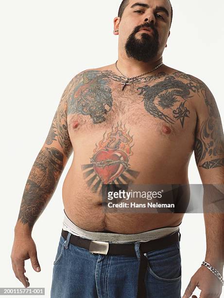 semi naked man with tattoos and goatee, portrait - white dragon tattoo stock pictures, royalty-free photos & images