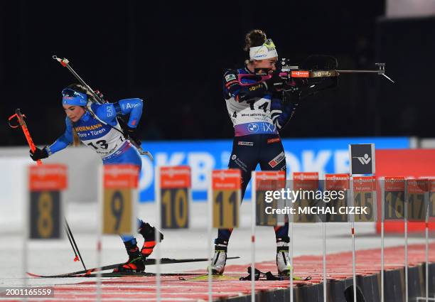 Italy's Dorothea Wierer and France's Lou Jeanmonnot-Laurent compete during the women's 15 km individual event of the IBU Biathlon World Championships...