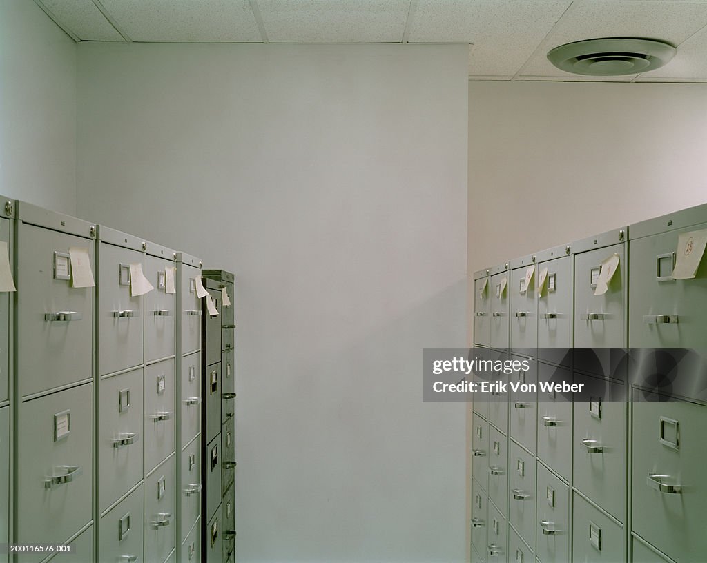 Filing cabinets with sticky notes in office