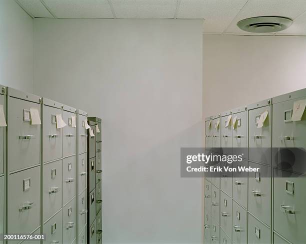 filing cabinets with sticky notes in office - drudgery stock pictures, royalty-free photos & images