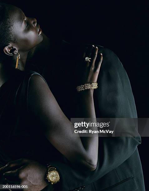 young couple embracing, close-up - orologio di lusso foto e immagini stock