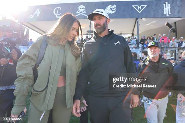 Captain Dustin Johnson of 4Aces GC celebrates with his wife Paulina Gretzky after winning the individual trophy during day three of the LIV Golf...