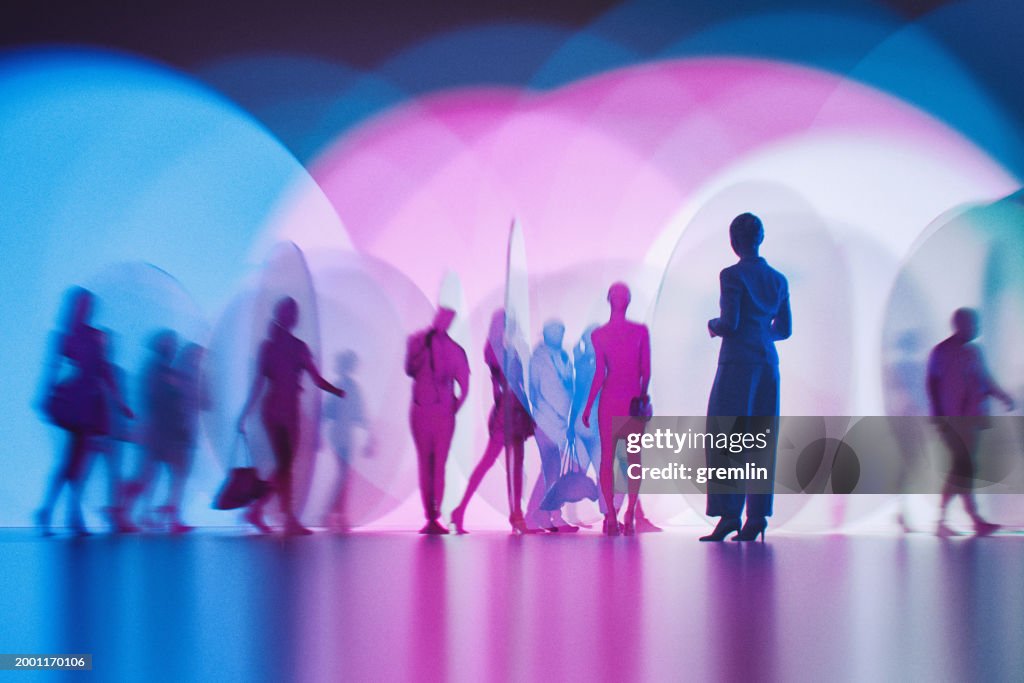 People silhouettes between abstract glass pieces