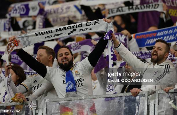 Real Madrid fans cheer prior to the UEFA Champions League Round of 16, first-leg football match between RB Leipzig and Real Madrid CF in Leipzig,...