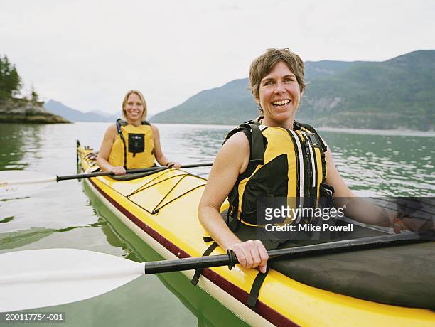 two women kayaking, portrait - kayaker woman stock pictures, royalty-free photos & images