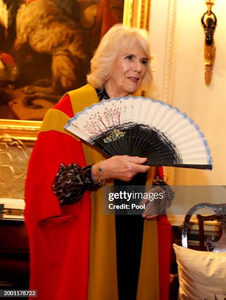 Queen Camilla was presented with a fan designed by Stewart Parvin during an installation ceremony at Clarence House, where she will be installed as...