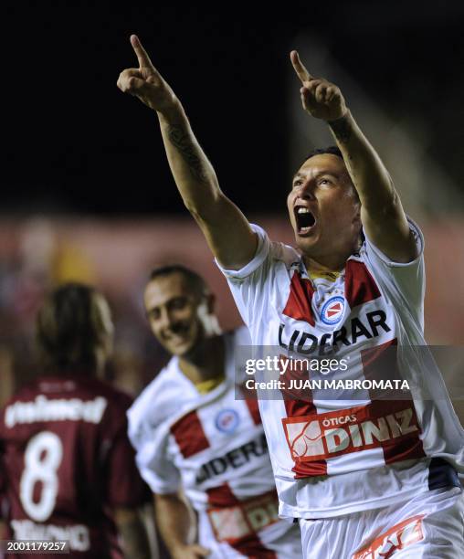 Argentina's Argentinos Juniors midfielder Gustavo Oberman celebrates next to teammate defender Gonzalo Prosperi after scoring the team's second goal...